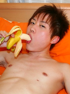 Cute Korean boy playing with his banana