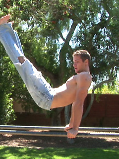 Flexible jock Neal exhibits his long dick after he strips naked