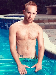 Steven Ponce posing by the pool